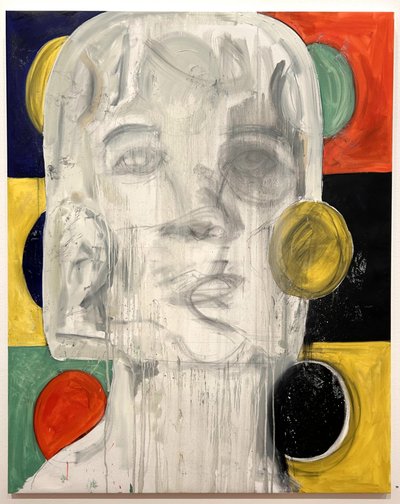 An elongated pale face with overlapping features, surrounded by red, yellow, green and black shapes.